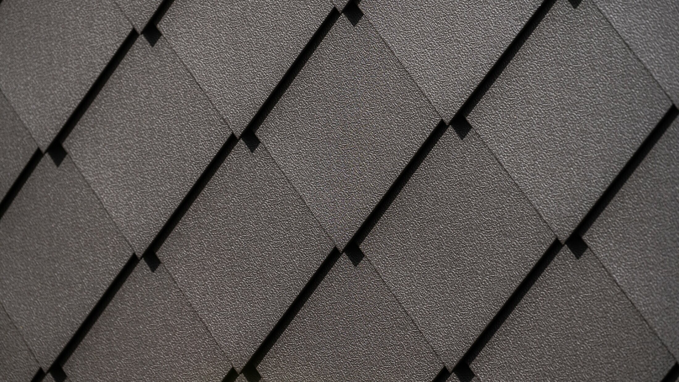 PREFA-vægrombe 29 × 29 i nøddebrun nærbillede med stucco-overflade